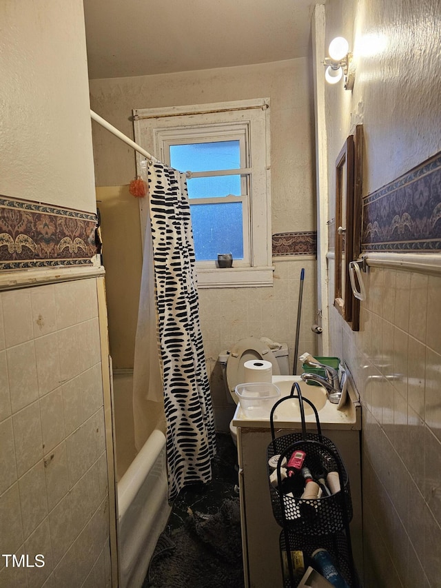 2928 N Patterson Ave, Winston-Salem, NC 27105 - full bathroom with tile walls, a wainscoted wall, shower / tub combo with curtain, and vanity