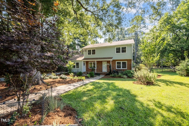 101 Hunter Pl, Carrboro, NC 27510 - view of front of house with brick siding and a front yard