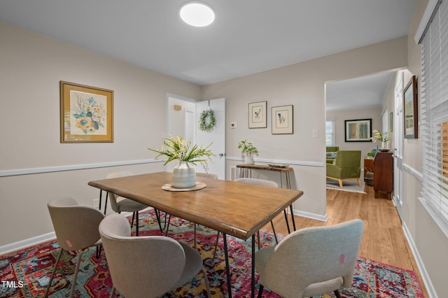 101 Hunter Pl, Carrboro, NC 27510 - dining area with light wood finished floors and baseboards