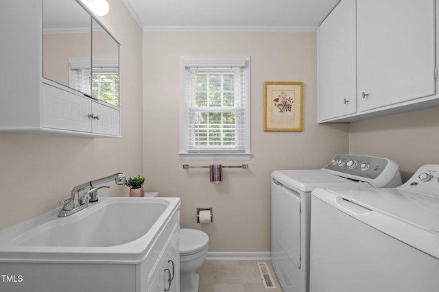 101 Hunter Pl, Carrboro, NC 27510 - laundry room featuring washer and dryer and ornamental molding