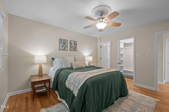 101 Hunter Pl, Carrboro, NC 27510 - bedroom featuring light wood-type flooring, a ceiling fan, and a spacious closet