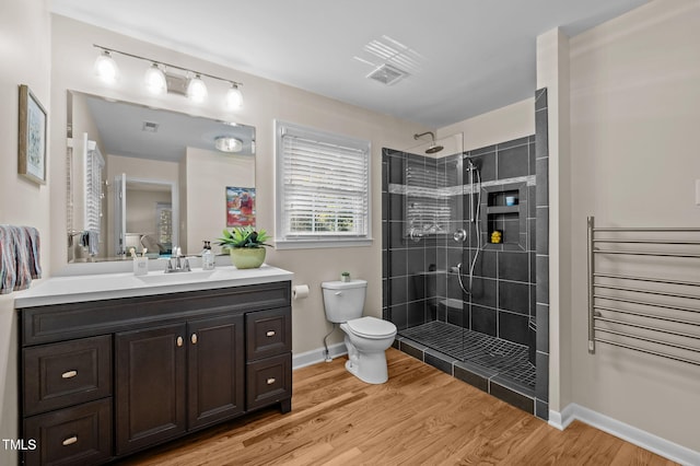 101 Hunter Pl, Carrboro, NC 27510 - full bathroom with vanity, tiled shower, and wood finished floors