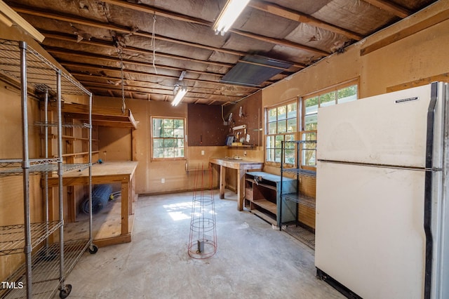 101 Hunter Pl, Carrboro, NC 27510 - below grade area featuring freestanding refrigerator and a workshop area