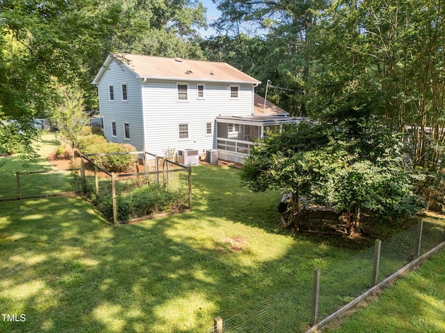 101 Hunter Pl, Carrboro, NC 27510 - rear view of property with a garden and a sunroom