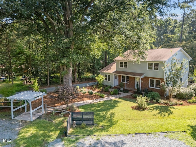 101 Hunter Pl, Carrboro, NC 27510 - view of front facade featuring brick siding, a pergola, and a front yard