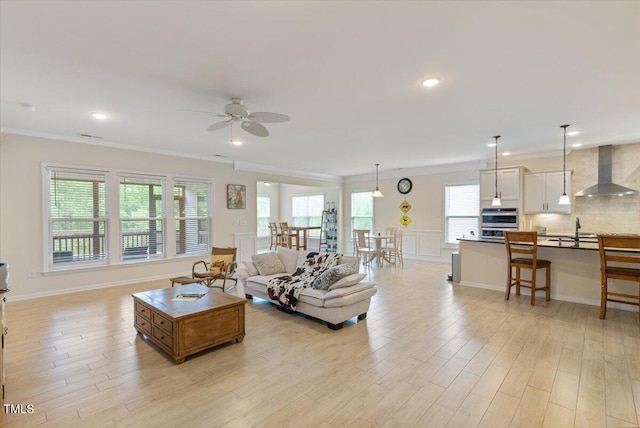 470 Duggins Pt, Apex, NC 27523 - living room with a ceiling fan, light wood finished floors, crown molding, and recessed lighting