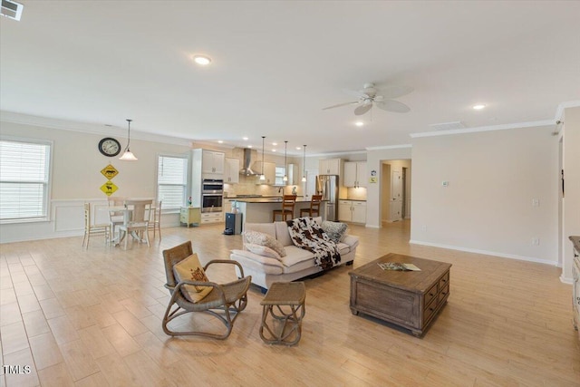 470 Duggins Pt, Apex, NC 27523 - living area with crown molding, a ceiling fan, light wood finished floors, and recessed lighting