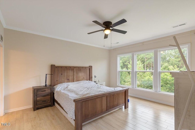 470 Duggins Pt, Apex, NC 27523 - bedroom with light wood finished floors, crown molding, and a ceiling fan