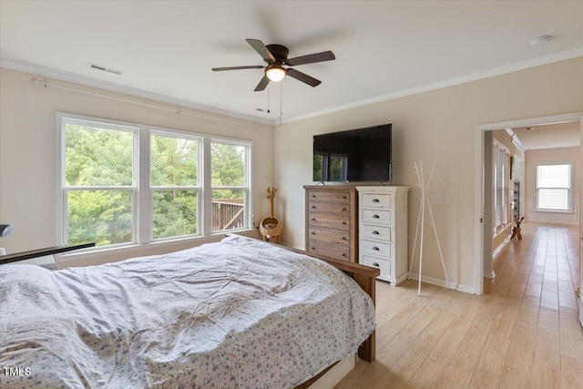 470 Duggins Pt, Apex, NC 27523 - bedroom featuring ornamental molding, light wood-style flooring, and a ceiling fan