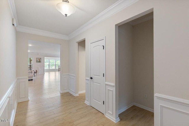 470 Duggins Pt, Apex, NC 27523 - hallway featuring crown molding, light wood-type flooring, wainscoting, and a decorative wall