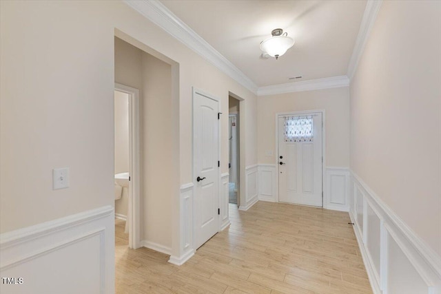 470 Duggins Pt, Apex, NC 27523 - hallway with crown molding, a decorative wall, light wood-style floors, and a wainscoted wall