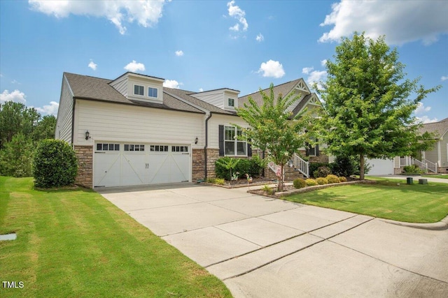 470 Duggins Pt, Apex, NC 27523 - view of front of property featuring stone siding, a garage, concrete driveway, and a front yard