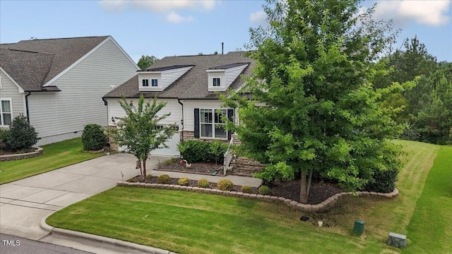 470 Duggins Pt, Apex, NC 27523 - view of front of home featuring driveway, a front yard, roof with shingles, and a garage