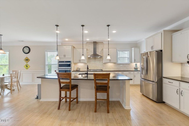 470 Duggins Pt, Apex, NC 27523 - kitchen with stainless steel appliances, wall chimney range hood, dark countertops, crown molding, and backsplash
