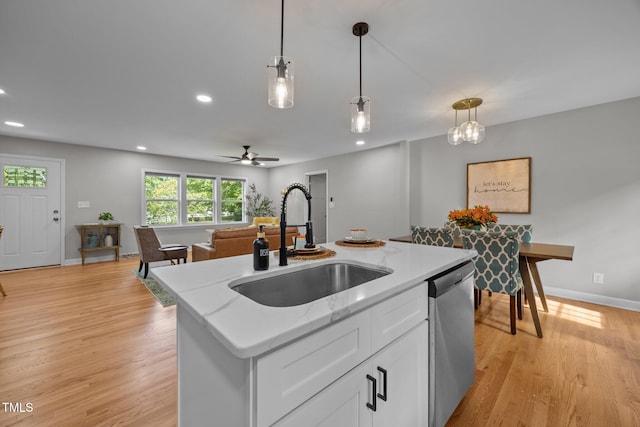 4011 Garrett Rd, Durham, NC 27707 - kitchen featuring dishwasher, pendant lighting, white cabinetry, recessed lighting, and a kitchen island with sink