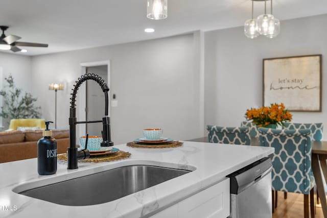 4011 Garrett Rd, Durham, NC 27707 - kitchen featuring stainless steel dishwasher, white cabinetry, a ceiling fan, hanging light fixtures, and recessed lighting