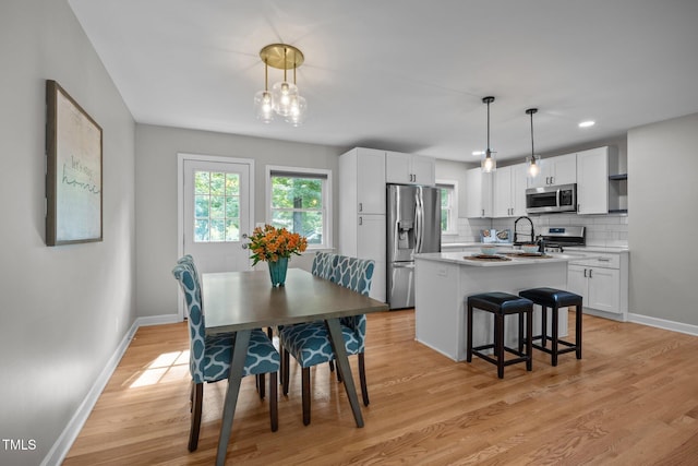 4011 Garrett Rd, Durham, NC 27707 - dining area with light wood-style flooring and recessed lighting