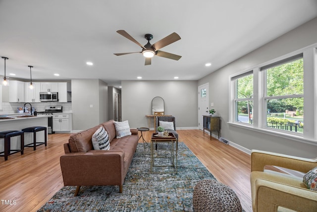 4011 Garrett Rd, Durham, NC 27707 - living area with ceiling fan, light wood-style floors, and recessed lighting