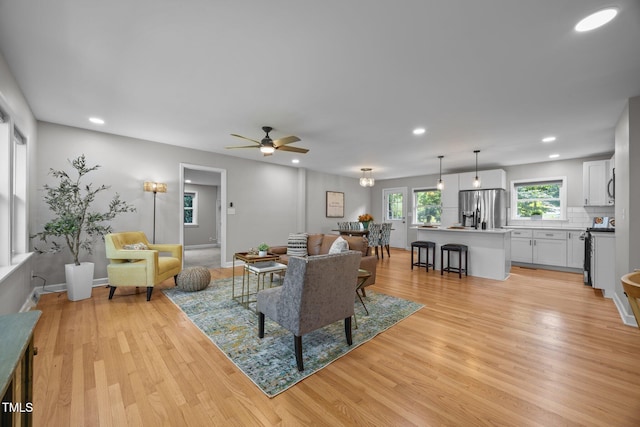 4011 Garrett Rd, Durham, NC 27707 - living room featuring light wood finished floors, a ceiling fan, and recessed lighting