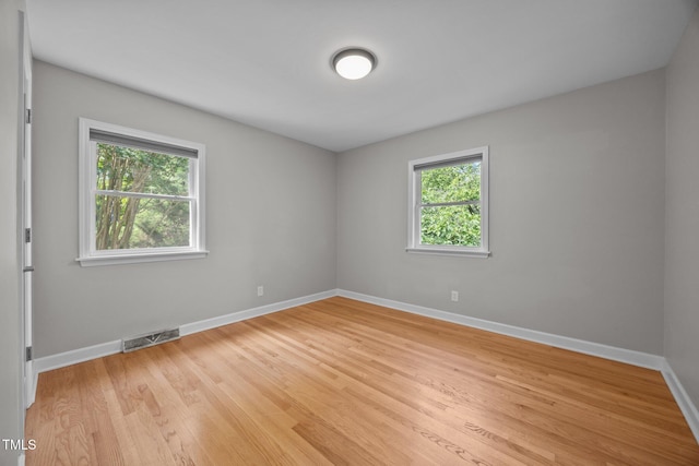 4011 Garrett Rd, Durham, NC 27707 - unfurnished room with baseboards and light wood-style flooring