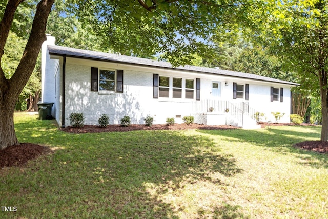 4011 Garrett Rd, Durham, NC 27707 - ranch-style home with a chimney, a front lawn, and brick siding