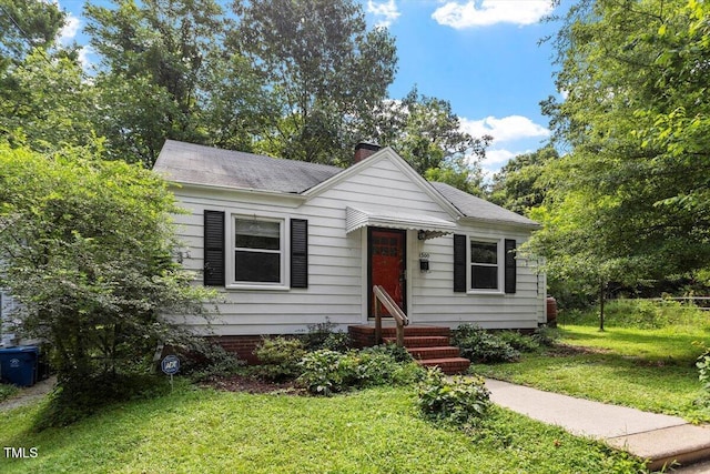 1300 Ruffin St, Durham, NC 27701 - bungalow-style home featuring a chimney, a front lawn, a shingled roof, and entry steps