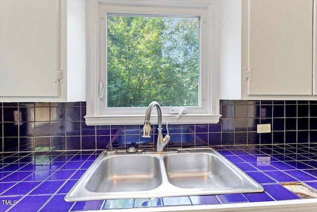 1300 Ruffin St, Durham, NC 27701 - kitchen view of tile countertops, white cabinets, and backsplash