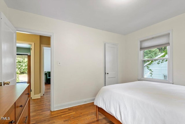 1300 Ruffin St, Durham, NC 27701 - bedroom with wood finished floors and multiple windows