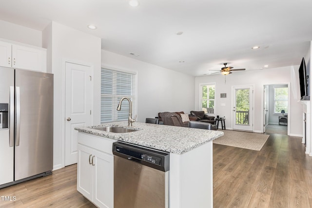 331 Sturgeon St, Smithfield, NC 27577 - kitchen with stainless steel appliances, recessed lighting, a ceiling fan, white cabinetry, and light stone counters