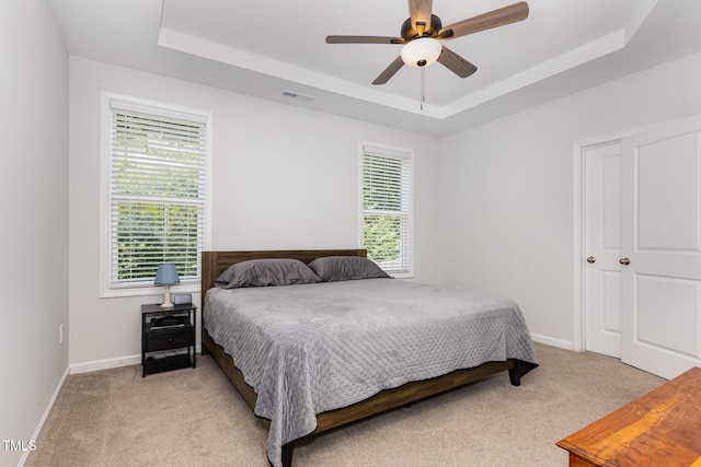 331 Sturgeon St, Smithfield, NC 27577 - bedroom with a raised ceiling, light colored carpet, and a ceiling fan
