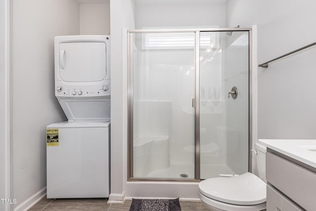 331 Sturgeon St, Smithfield, NC 27577 - bathroom featuring stacked washer / dryer, a shower stall, and vanity