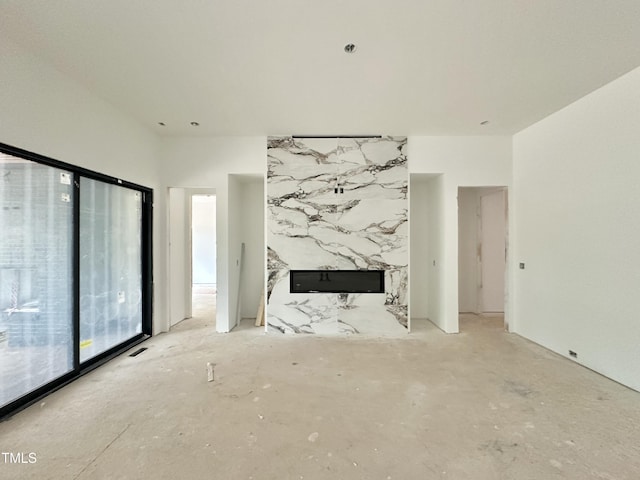 7809 Haymarket Ln, Raleigh, NC 27615 - unfurnished living room featuring a premium fireplace