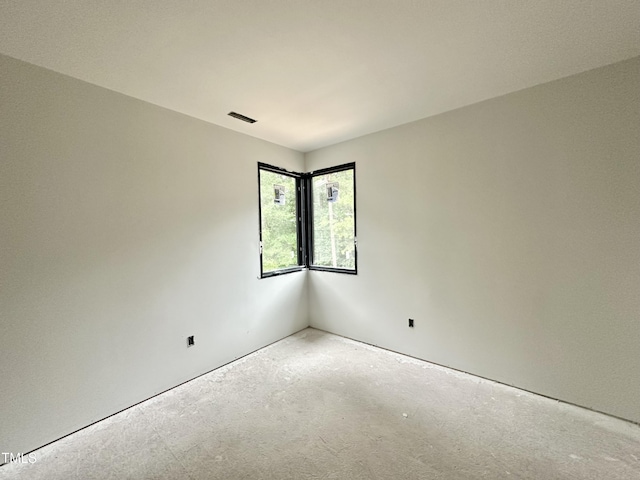 7809 Haymarket Ln, Raleigh, NC 27615 - empty room with unfinished concrete flooring