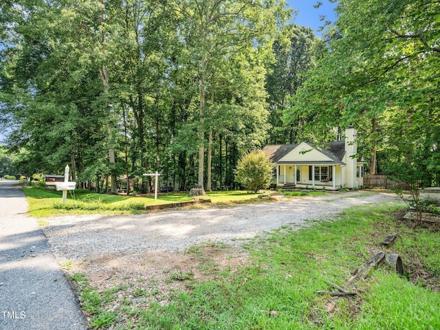 129 Nottingham Ct, Youngsville, NC 27596 - view of front of property featuring covered porch and a chimney