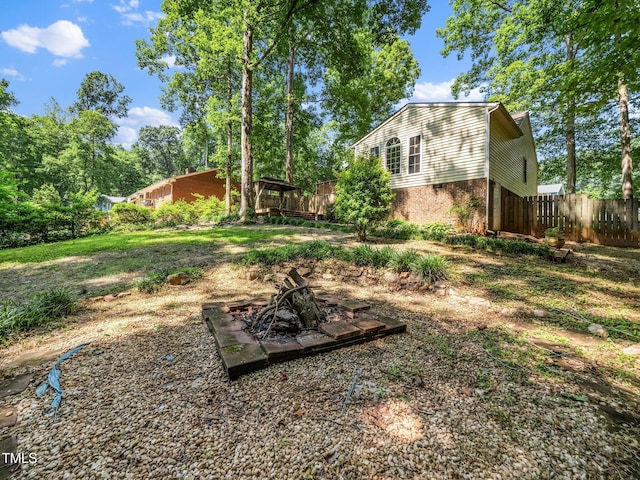 129 Nottingham Ct, Youngsville, NC 27596 - view of yard featuring a fire pit