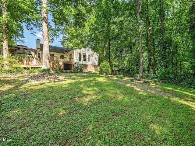 129 Nottingham Ct, Youngsville, NC 27596 - view of grassy yard featuring a wooden deck