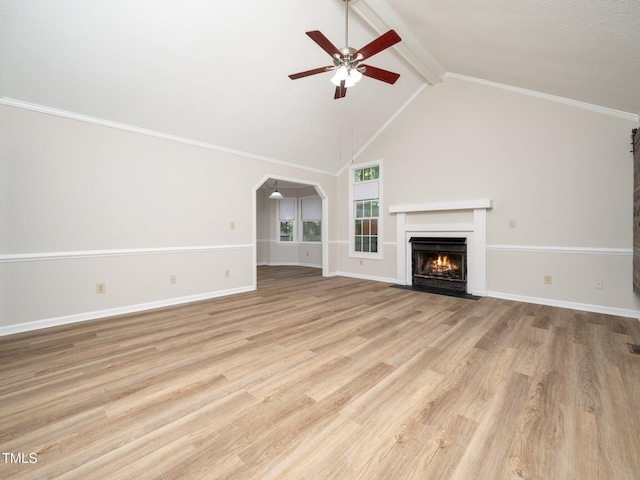 129 Nottingham Ct, Youngsville, NC 27596 - unfurnished living room with ceiling fan, a fireplace with flush hearth, light wood-type flooring, and arched walkways