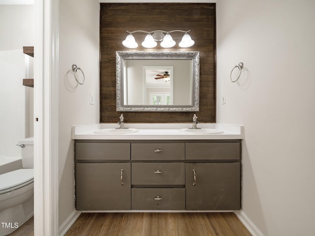 129 Nottingham Ct, Youngsville, NC 27596 - bathroom with double vanity and wood finished floors