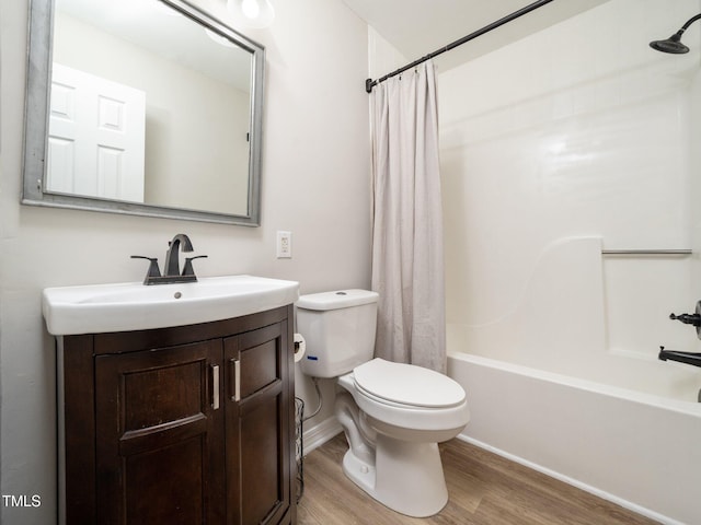 129 Nottingham Ct, Youngsville, NC 27596 - bathroom with wood finished floors, shower / bathtub combination with curtain, and vanity