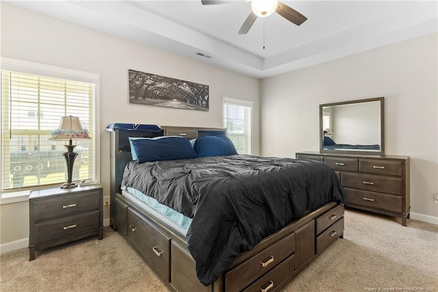 1657 Stackhouse Dr, Fayetteville, NC 28314 - bedroom with light carpet, a raised ceiling, and ceiling fan