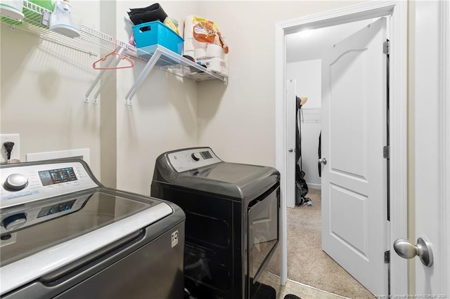 1657 Stackhouse Dr, Fayetteville, NC 28314 - laundry area with washer and clothes dryer and carpet flooring
