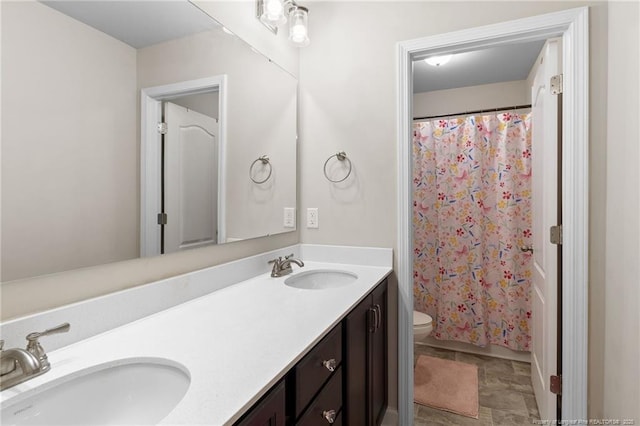 1657 Stackhouse Dr, Fayetteville, NC 28314 - bathroom with double vanity and a shower with shower curtain