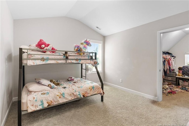 1657 Stackhouse Dr, Fayetteville, NC 28314 - carpeted bedroom with vaulted ceiling, a spacious closet, and a closet