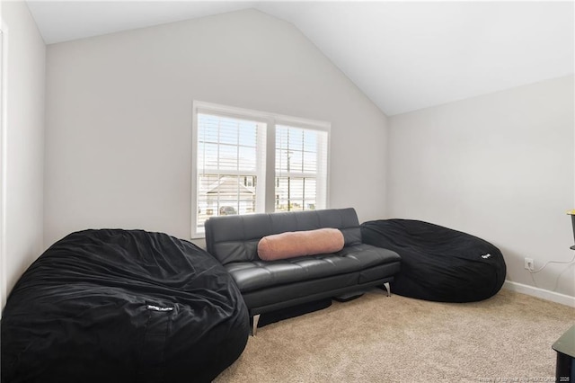 1657 Stackhouse Dr, Fayetteville, NC 28314 - carpeted living room featuring vaulted ceiling and baseboards