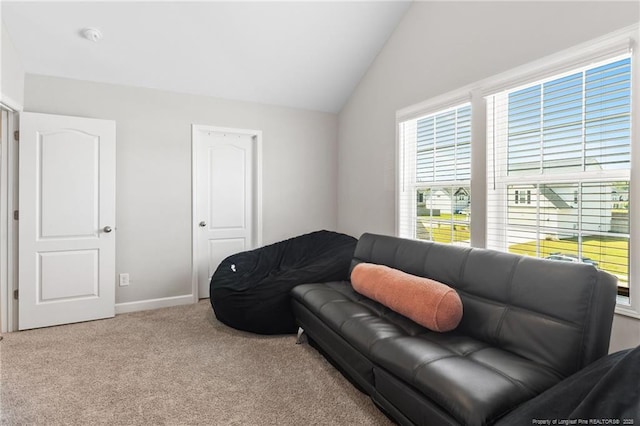 1657 Stackhouse Dr, Fayetteville, NC 28314 - carpeted living area with lofted ceiling and baseboards