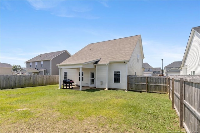 1657 Stackhouse Dr, Fayetteville, NC 28314 - rear view of property featuring a fenced backyard, a patio area, a residential view, and a shingled roof