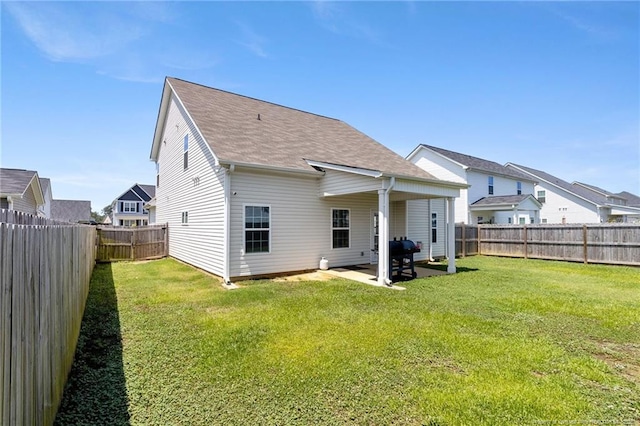 1657 Stackhouse Dr, Fayetteville, NC 28314 - back of property featuring a fenced backyard, a patio, a shingled roof, and a residential view