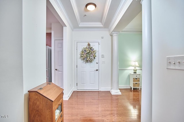 10410 Rosegate Ct Unit 105, Raleigh, NC 27617 - foyer entrance with ornate columns, wood finished floors, crown molding, and a raised ceiling