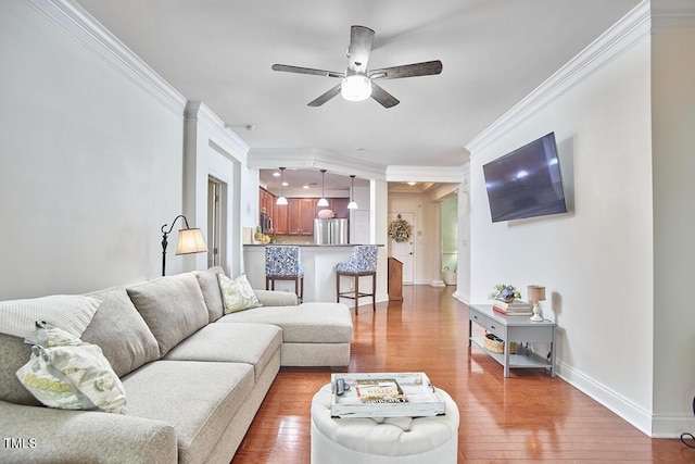 10410 Rosegate Ct Unit 105, Raleigh, NC 27617 - living room with crown molding, a ceiling fan, and hardwood / wood-style floors