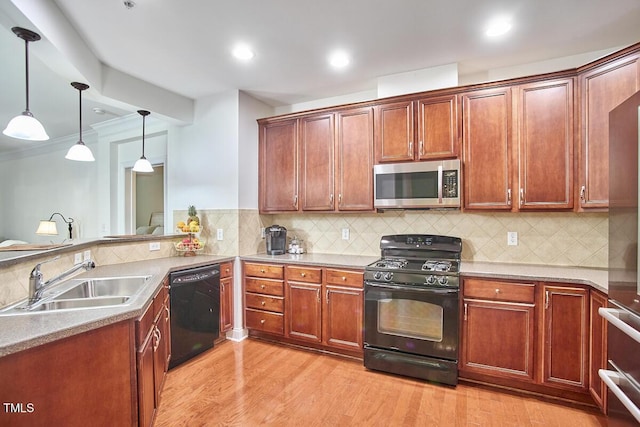 10410 Rosegate Ct Unit 105, Raleigh, NC 27617 - kitchen with black appliances, light wood-style floors, pendant lighting, backsplash, and recessed lighting